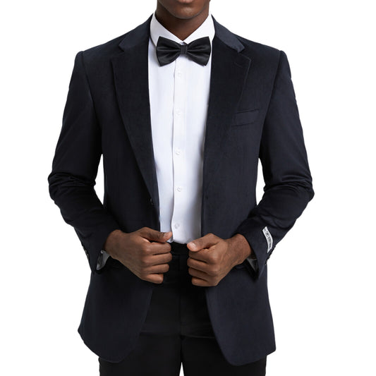 Elegant man in a classic black velvet blazer for formal events.