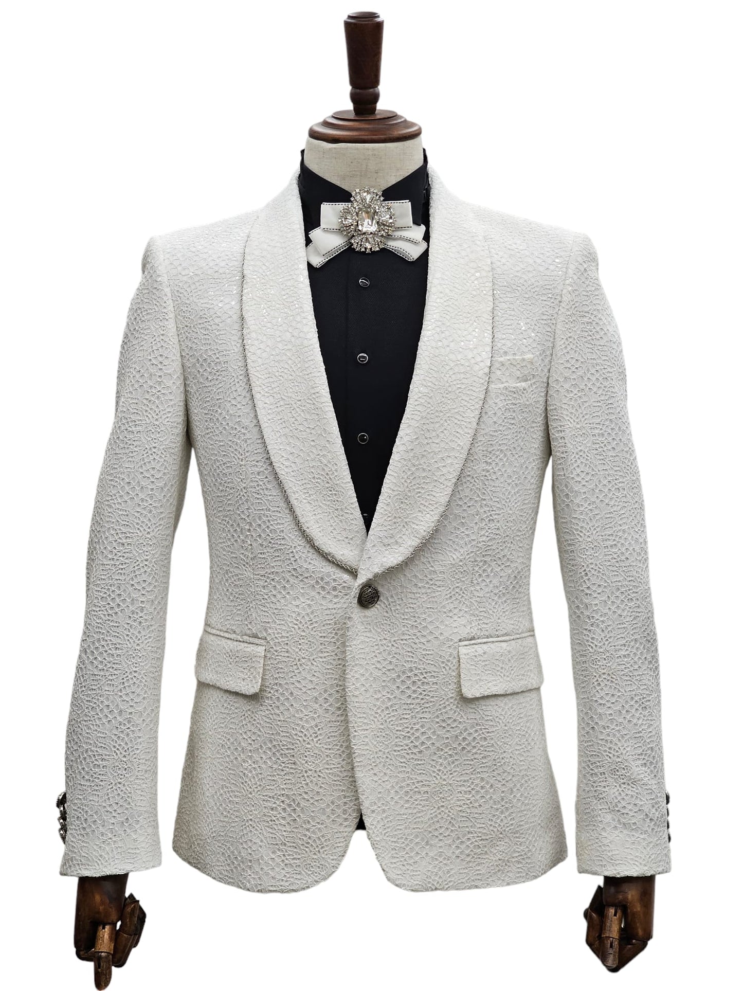 KCT Menswear's white textured tuxedo suit with an intricate pattern, perfect for high-class events.